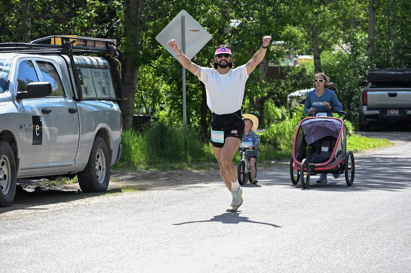 Runner celebrating at the finish of a Teton Adaptive Sports race